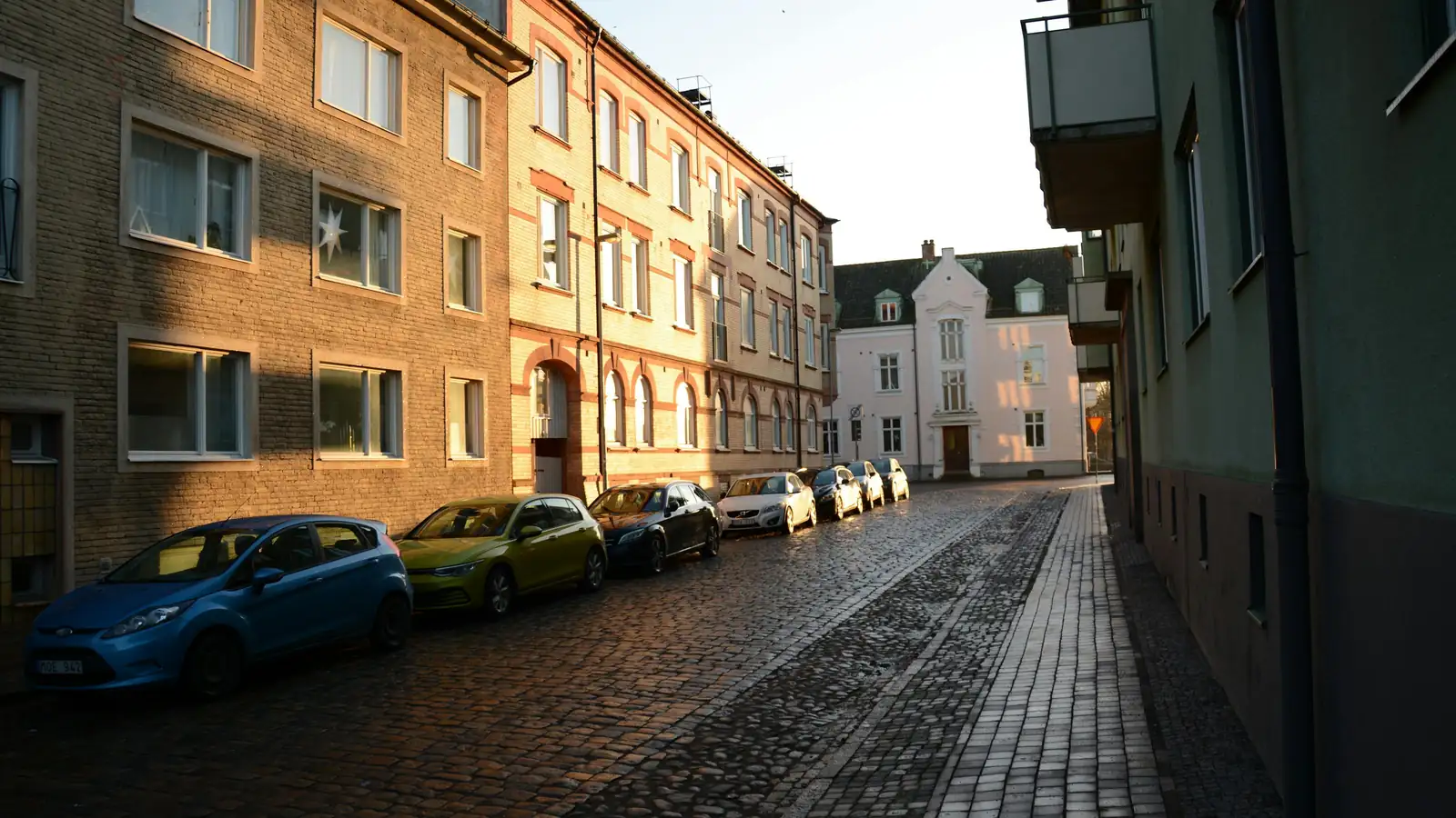 Electric city car on a sunrise city street