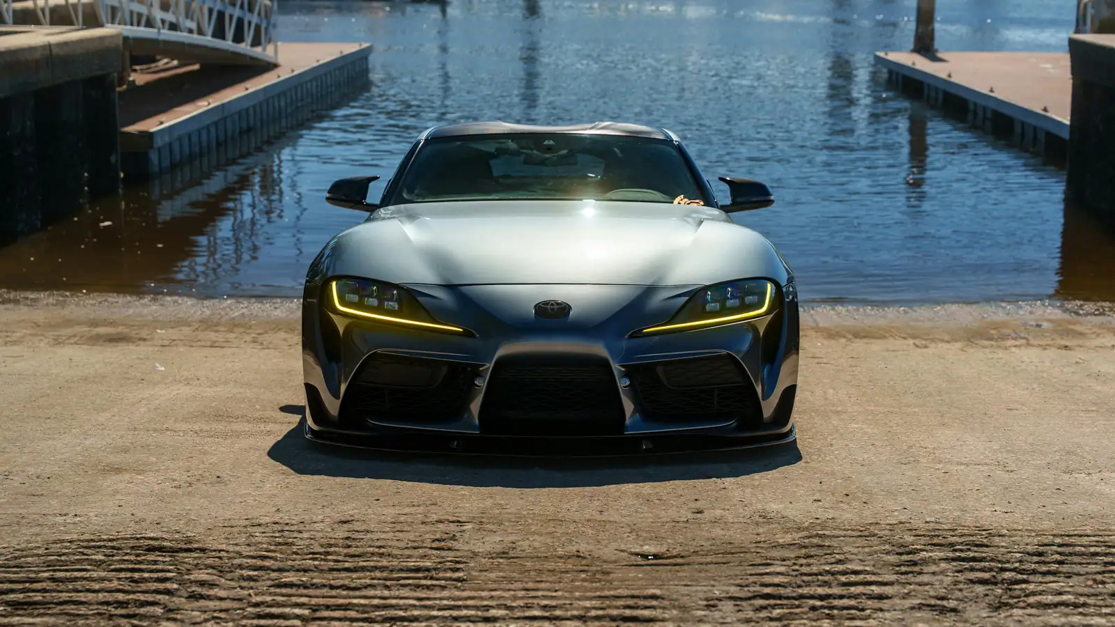 Premium car near a marina at dusk